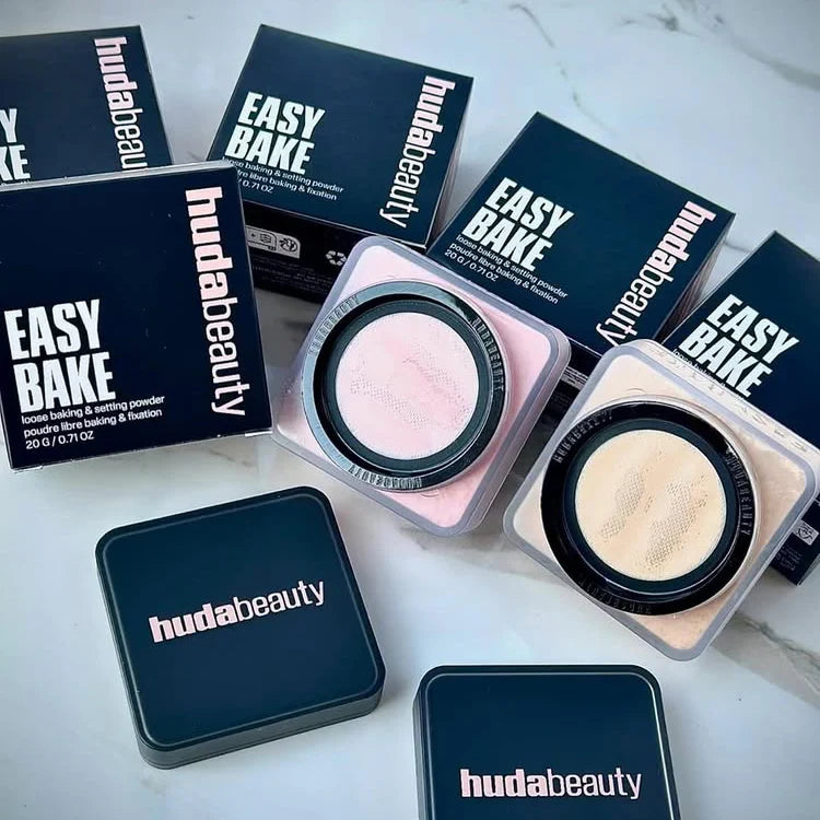 Huda Beauty Easy Bake makeup products on a white surface