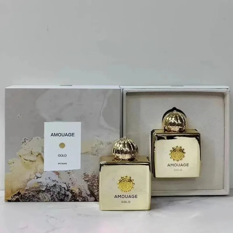 Amouage Gold perfume bottles with packaging on a light background