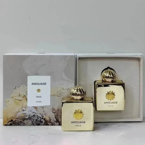 Amouage Gold perfume bottles with packaging on a light background
