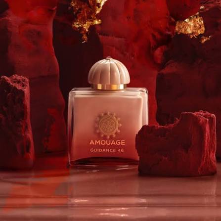 Amouage Guidance 46 perfume bottle in a square glass container with a ribbed cream cap and gold lettering, set against a dramatic red rock background.