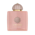 Amouage Guidance perfume bottle in a soft pink color with a ribbed dusty rose cap and gold lettering on the front.
