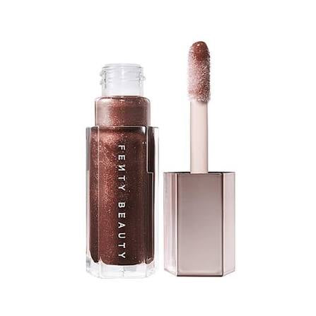 Fenty Beauty lip gloss with applicator on a white background