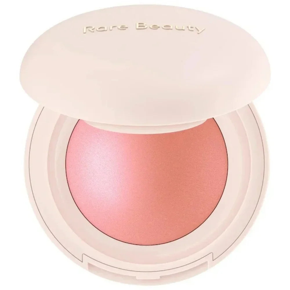 Compact blush with pink shade and 'Rare Beauty' branding on a white background