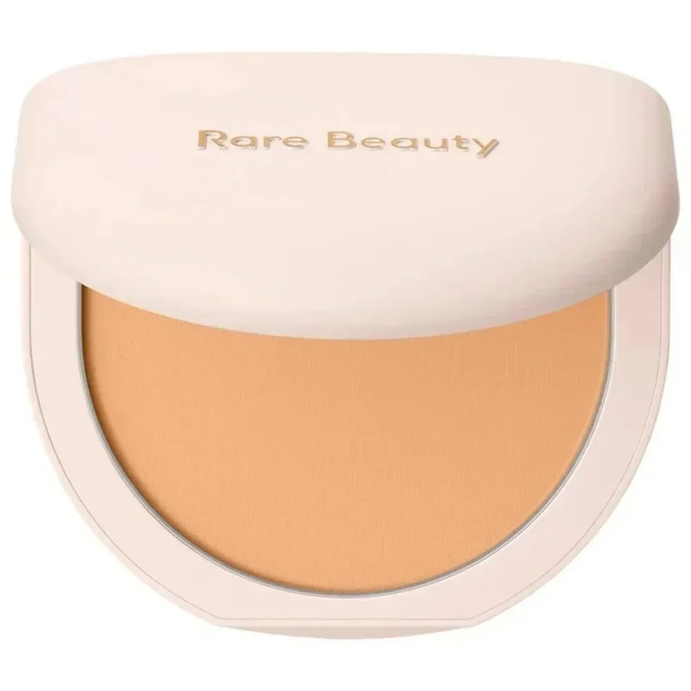 Compact powder with 'Rare Beauty' branding on a white background