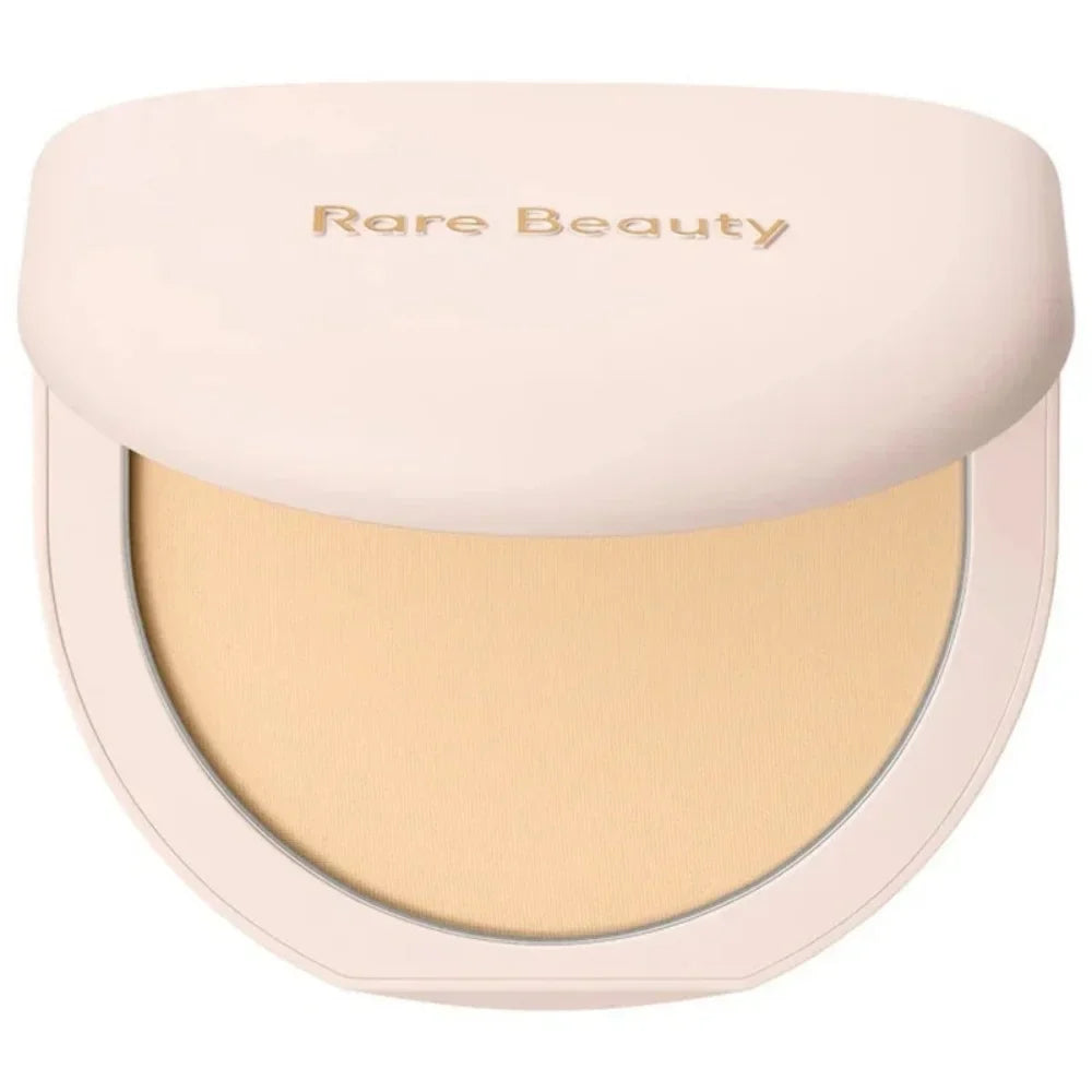 Compact powder with 'Rare Beauty' branding on a white background