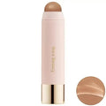 Makeup stick with a beige shade on a white background, featuring the brand 'Rare Beauty'.