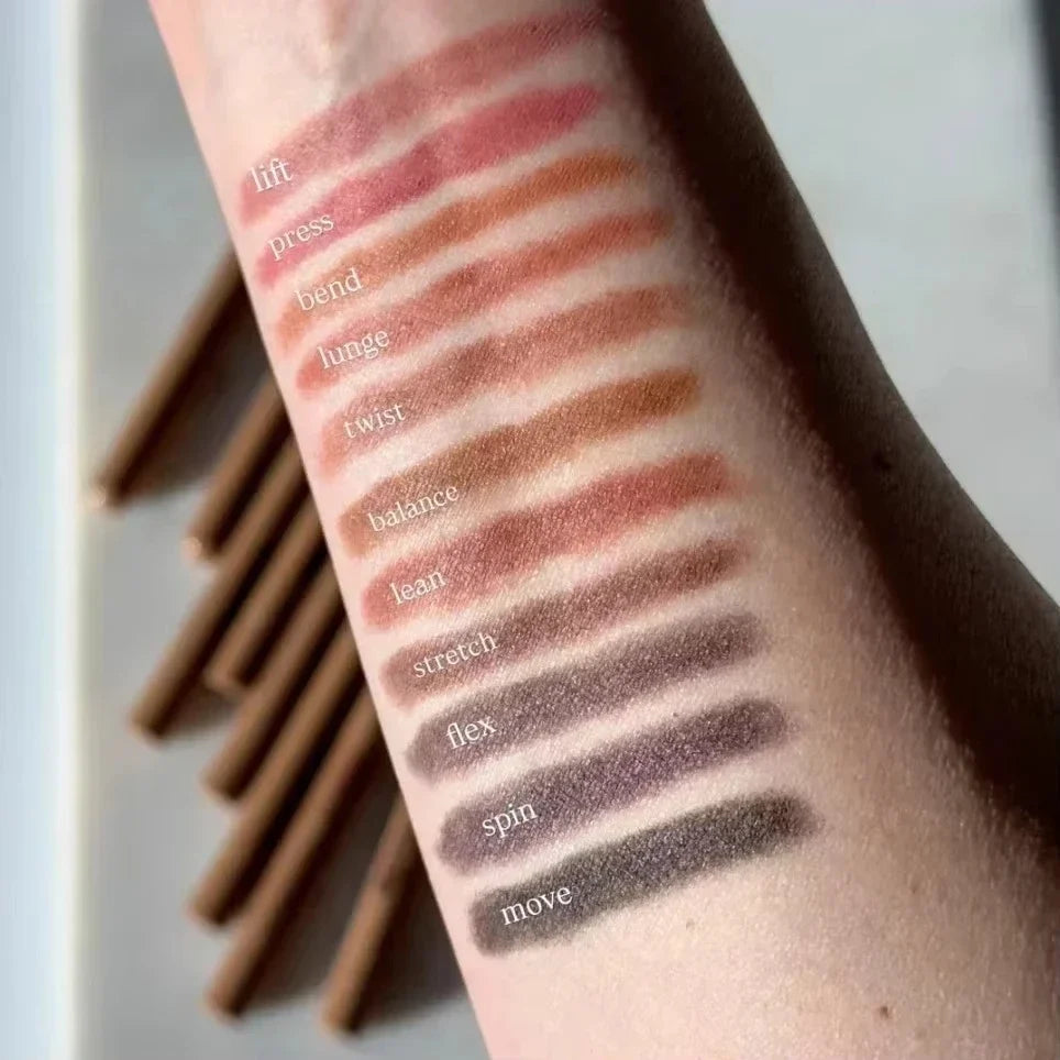Makeup swatches on a person's arm with text labels