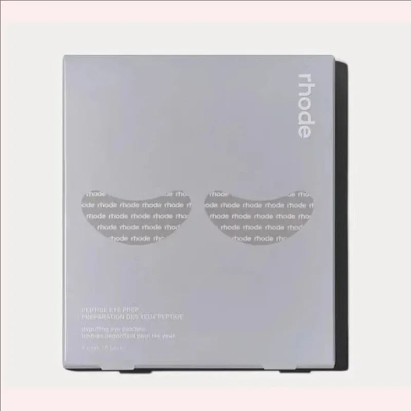 Product packaging with 'rhode' branding on a light gray background