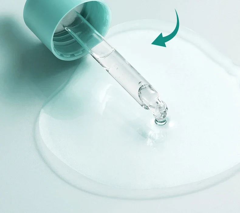Glass dropper with a teal cap on a light blue background